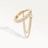 Piercing hélix anneau doré serti de strass et double chaîne pendante, vue de trois-quarts