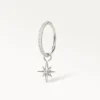 Anneau de piercing argenté orné d’un pendentif étoile brillante, style délicat