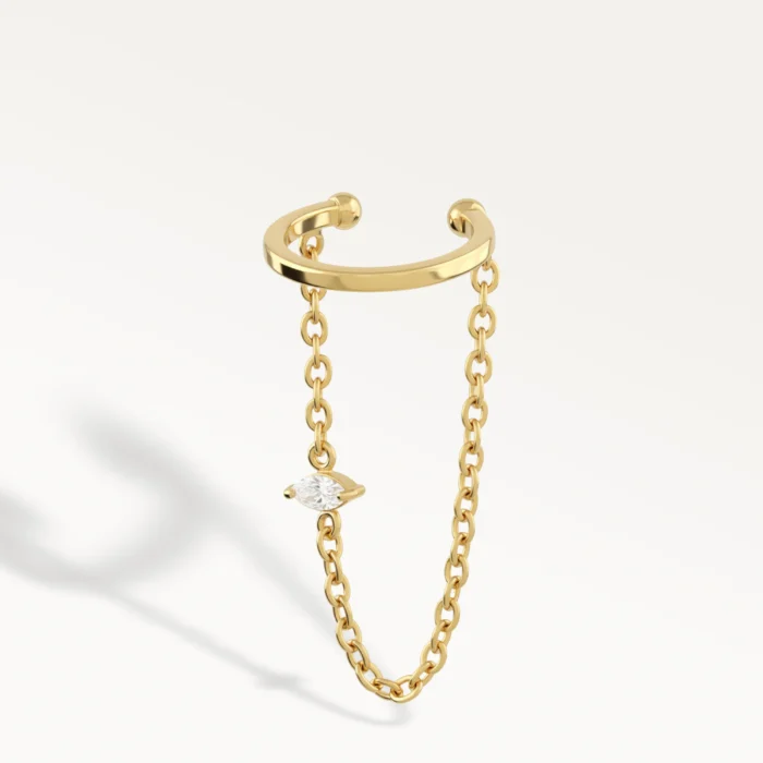 Ear cuff doré avec chaîne avec une pierre sur la chaine