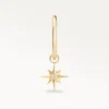 Piercing anneau doré avec étoile pendante sertie d’un zircon, vue de face élégante