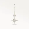 Piercing anneau argenté avec pendentif étoile brillante, bijou fin et moderne