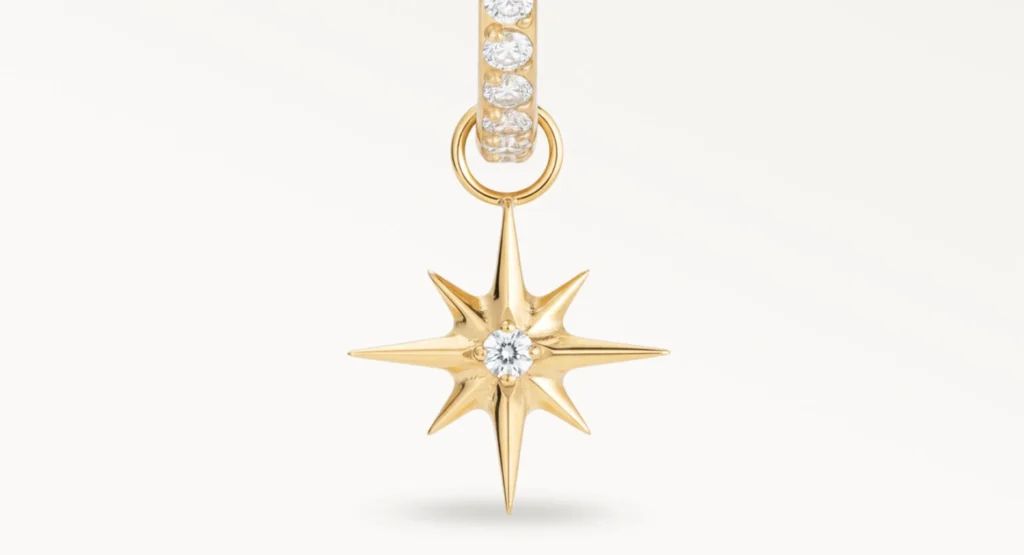 Piercing anneau doré avec pendentif étoile et zircon central, vue en gros plan détaillée