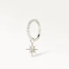 Piercing anneau argenté orné d’un pendentif étoile lumineuse, style délicat et chic