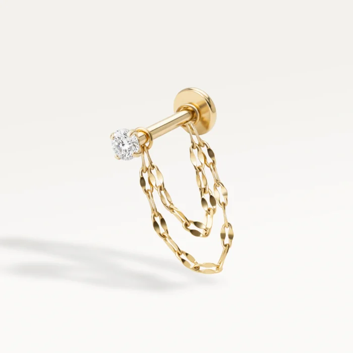 Piercing d’oreille doré à double chaînette, bijou délicat et raffiné