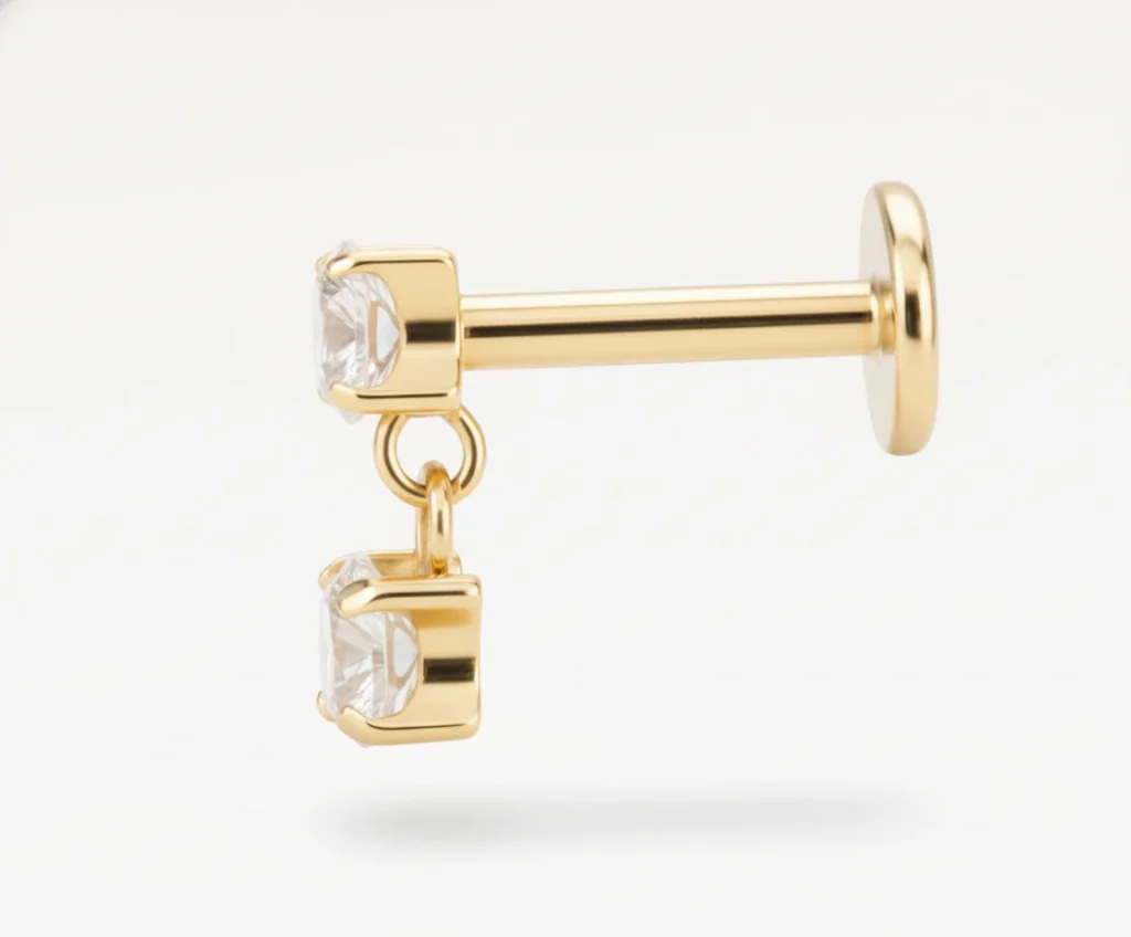 Piercing puce en titane doré avec deux zircons brillants en pendentif mobile