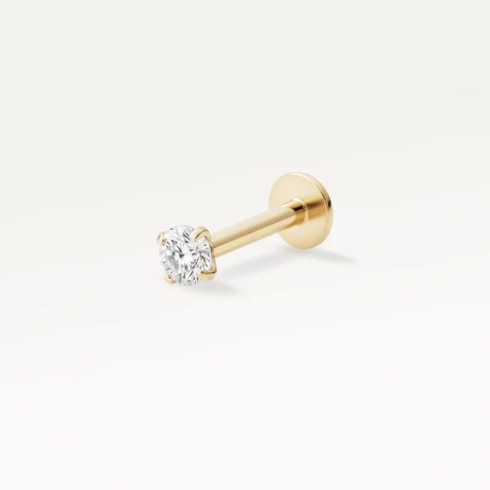 Piercing doré orné d’un strass brillant, bijou discret et lumineux