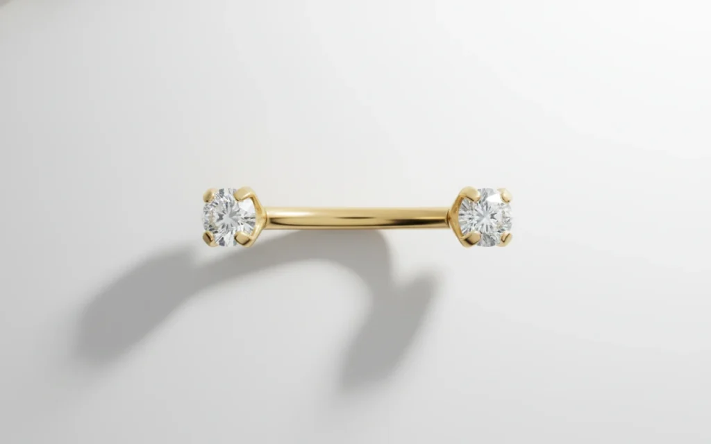 Piercing banane doré avec deux strass étincelants, bijou courbé élégant et lumineux