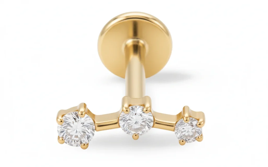 Piercing Evergold doré à trois zircons brillants, finition raffinée