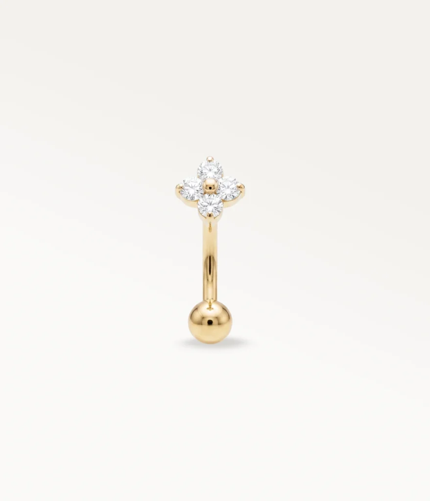Vue de face d'un piercing banane fleur doré avec zircons, accessoire d'hélix éclatant